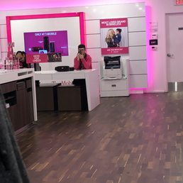 Employees on their phones.