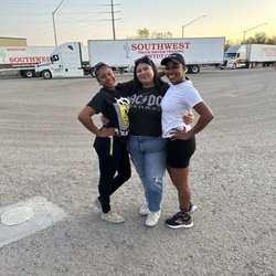 Southwest Truck Driver Training - Our trucks in the back and our Girl Power