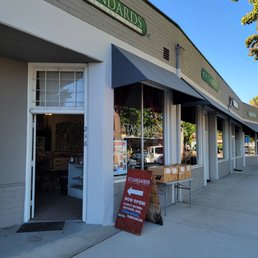 Exterior view of Standards: A Record Store in Vista, CA, showing store signage, entrance, and sidewalk with a promotional sign.