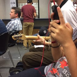 Social Security - Guitar player waiting at the SS office