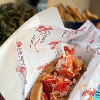 Cousins Maine Lobster - Detroit - a lobster sandwich in a paper wrapper - Seafood Near Me Cousins Maine Lobster - Detroit - a lobster sandwich in a paper wrapper - Seafood Near Me