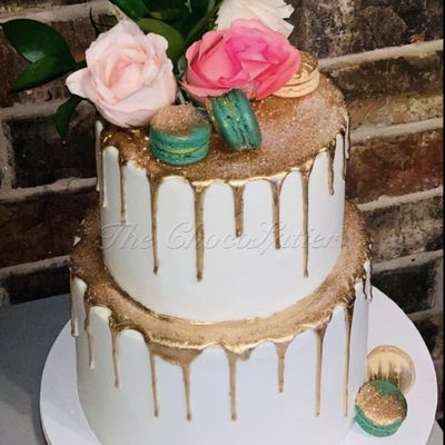 The Grand Celebration Cake - Whether you’re marking an anniversary, graduation, or any significant milestone, our Grand Celebration Cakes are designed to make your event truly memorable. Each cake is a masterpiece, tailored to your specifications and made with the highest quality ingredients to ensure a taste experience that’s as special as the occasion itself.