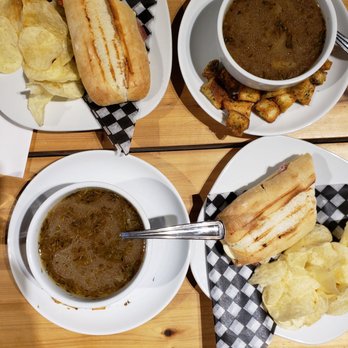 Sorella - three plates of food on a wooden table - Italian Near Me - Kirkland, Quebec