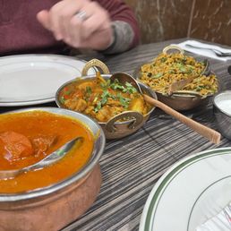 Butter chicken to the left, Kadai chicken in the middle and Chicken Biryani to the right! Butter chicken to the left, Kadai chicken in the middle and Chicken Biryani to the right!
