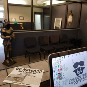 Crimson Breed Tattoo Studio - Waiting area and reception desk. - Piercing Near Me - Bloomington, Indiana