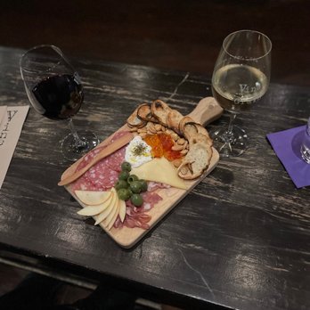 Vine + Grain - a wooden cutting board with cheese, meat, and bread - Wine Bars Near Me - Brentwood, California Vine + Grain - a wooden cutting board with cheese, meat, and bread - Wine Bars Near Me - Brentwood, California