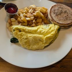 Spinach Mushroom American cheese omelette with breakfast potatoes and an English muffin