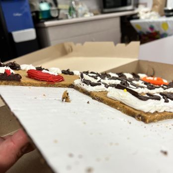 Great American Cookies - a hand holding a box of cookies - Desserts Near Me - Cedar Park, Texas Great American Cookies - a hand holding a box of cookies - Desserts Near Me - Cedar Park, Texas