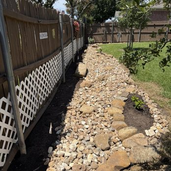 Sprouts Lawn & Landscape - I had drainage issues in my lawn so I got this beautiful dry creek bed! Bill was on time, professional and got the job done in no time. - Landscape Architects or Designers Near Me Sprouts Lawn & Landscape - I had drainage issues in my lawn so I got this beautiful dry creek bed! Bill was on time, professional and got the job done in no time. - Landscape Architects or Designers Near Me