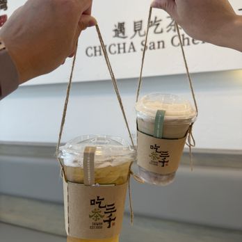 Chicha San Chen - Green Tea + honey on the left; Dong Ding Oolong Tea + oat milk + taro on the right - Bubble Tea Near Me - Austin, Texas Chicha San Chen - Green Tea + honey on the left; Dong Ding Oolong Tea + oat milk + taro on the right - Bubble Tea Near Me - Austin, Texas