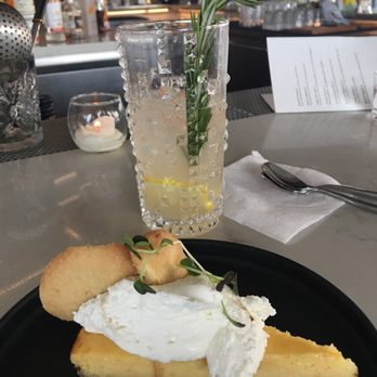 Santo Cielo - Lemon Meyer pie and maiden voyage drink - vodka with herb infused flavors and rosemary sprig. - New American Near Me - Naperville, Illinois