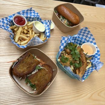 Nopa Fish - Fried rockfish sandwich (top right), fried tofu sandwich, (bottom left) - Seafood Near Me - San Francisco, California Nopa Fish - Fried rockfish sandwich (top right), fried tofu sandwich, (bottom left) - Seafood Near Me - San Francisco, California