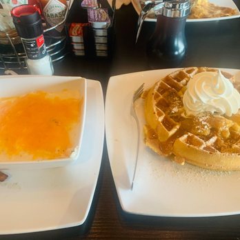 CanopyRoad Cafe - Apple Cinnamon Waffle w a side of Cheese Grits & bacon - Breakfast & Brunch Near Me - Tampa, Florida CanopyRoad Cafe - Apple Cinnamon Waffle w a side of Cheese Grits & bacon - Breakfast & Brunch Near Me - Tampa, Florida