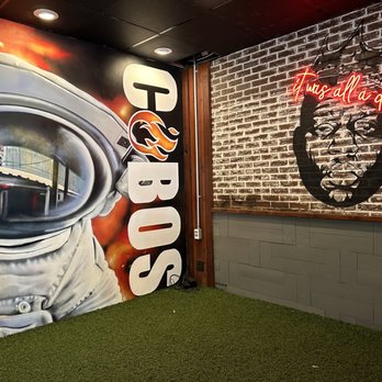 Cobo's - a mural of an astronaut in a space suit - Barbeque Near Me - Houston, Texas Cobo's - a mural of an astronaut in a space suit - Barbeque Near Me - Houston, Texas
