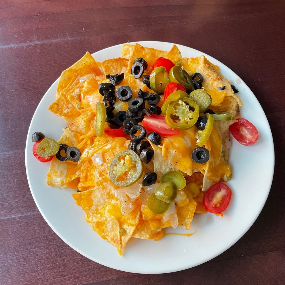 a plate of nachos on a table