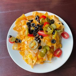 a plate of nachos on a table