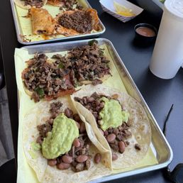 Birria taco, Poblano Taco, Sonora Taco with the beans way back to the right is the Surf and Turf Taco which is the best I ever had