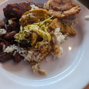 Alamar Dominican Kitchen - share plate of the pollo guisado and one tostone - Comfort Food Near Me - Oakland, California