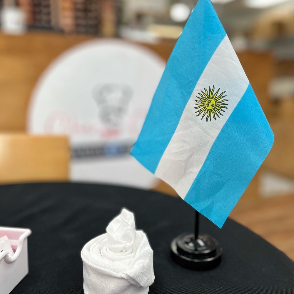 Che Cafe Empanadas Argentinas Logo