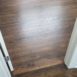 Threshold of one of the bedrooms. New in bedroom, old in hallway.