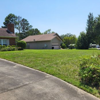 Black Ops Lawn - a driveway with a lawn and a house in the background - Lawn Services Near Me - Prattville, Alabama Black Ops Lawn - a driveway with a lawn and a house in the background - Lawn Services Near Me - Prattville, Alabama