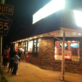 Blinker Frozen Custard - people standing outside of a restaurant at night - Ice Cream & Frozen Yogurt Near Me - Millville, New Jersey