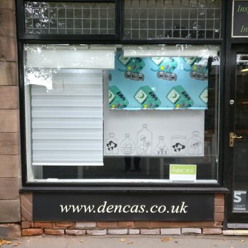 Dencas By Design - Front showroom window with bespoke roller blinds, drawn by our in house graphic designer. - Shades & Blinds Near Me - Chester, CHW Dencas By Design - Front showroom window with bespoke roller blinds, drawn by our in house graphic designer. - Shades & Blinds Near Me - Chester, CHW