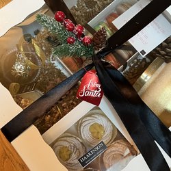 Haakenson Desserts - Custom gift box with macarons, hot chocolate bombs, Brazo de Mercedes cupcakes, and an Anthropologie candle