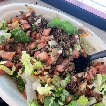 Chipotle Mexican Grill - Bowl of rice, 2 servings of barbacoa and 1 chicken with pico and lettuce.  The services are SMALL while they pile on the rice. - Fast Food Near Me - Round Rock, Texas