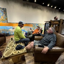 Emerald Water Anglers - The "living room" space at the soft opening of EWA's new location during the West Seattle Wine Walk. Dave McCoy, owner, on the left.
