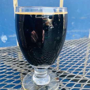 Chatterbox Pub - a glass of beer on a table - Bars Near Me - Minneapolis, Minnesota
