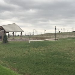 Friedman Park - Amphitheater with stage and tiered grass/stone seating for special events.