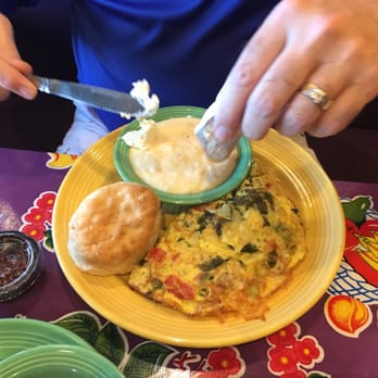 The Flying Biscuit Cafe - Low Country omelette with shrimp,crab & collards. Grits & biscuit. - New American Near Me - Gainesville, Florida The Flying Biscuit Cafe - Low Country omelette with shrimp,crab & collards. Grits & biscuit. - New American Near Me - Gainesville, Florida