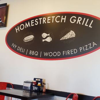 Homestretch Grill - a dining area with red chairs - American Near Me - Batavia, New York