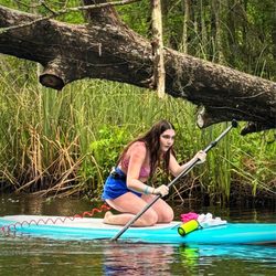 Amelia Island Paddle Surf Company - Paddle boarding on calm waters