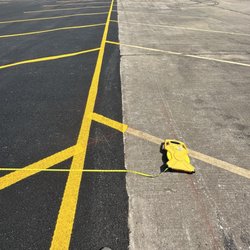 Allsons Asphalt Paving & Construction - Parking lot tapers in because Jack Young didn't want to purchase another truck of asphalt to do the job right.