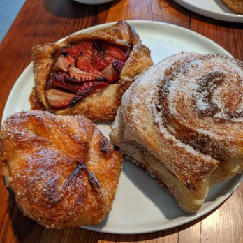 Levee Baking Co. - Clockwise: Strawberry Galette, Cinnamon Roll, Kouign-amann - Bakeries Near Me - New Orleans, Louisiana Levee Baking Co. - Clockwise: Strawberry Galette, Cinnamon Roll, Kouign-amann - Bakeries Near Me - New Orleans, Louisiana