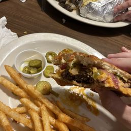 Cowboy Burger (with added jalapeños) and fries. Hamburger steak, baked potatoes, and cabbage. (Far plate) Cowboy Burger (with added jalapeños) and fries. Hamburger steak, baked potatoes, and cabbage. (Far plate)