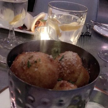 The West End - Truffle tots with steam buns in the background. - New American Near Me - Hyannis, Massachusetts The West End - Truffle tots with steam buns in the background. - New American Near Me - Hyannis, Massachusetts