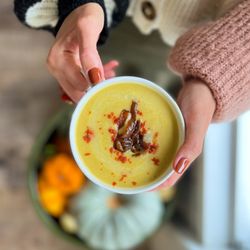 Soupchu | Homemade Soups, Stews & Broths - Red Lentil Soup - Blended carrot, onion, and potato with caramelized onion with sesame seed and paprika.