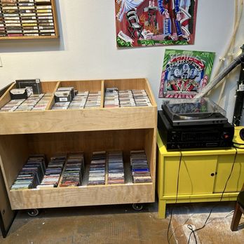 Mint Gallery Records - Other part of listening station with a rack of cassette tapes - Vinyl Records Near Me - Portland, Oregon Mint Gallery Records - Other part of listening station with a rack of cassette tapes - Vinyl Records Near Me - Portland, Oregon