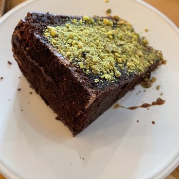 d’Alba - Mousse cake with "pistachio soil and dehydrated raspberries" - New American Near Me - Houston, Texas
