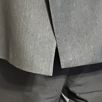 Elegance Dry Cleaners - This is a close up of the atrocious job of lining up the jacket and button - Dry Cleaning Near Me - Denver, Colorado Elegance Dry Cleaners - This is a close up of the atrocious job of lining up the jacket and button - Dry Cleaning Near Me - Denver, Colorado