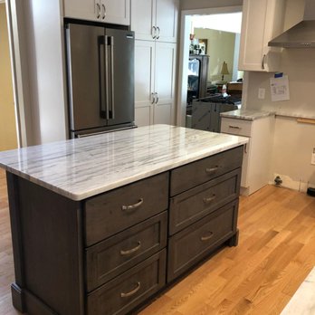 All Matters General Contracting - a kitchen with a marble island - General Contractors Near Me - North Reading, Massachusetts