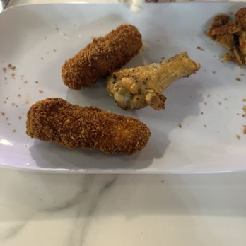 Ruckus - Dark brown / red, heavily breaded cheese sticks vs. delicious golden brown chicken drum which use to be the color of the cheese sticks. - Pizza Near Me - Raleigh, North Carolina