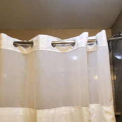 Holiday Inn Express & Suites Lebanon - Shower curtain keeps falling away from the walls. The rod should bow OUT, not down!