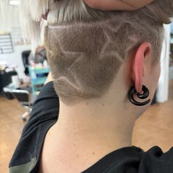 She shaved stars into the back of my head, however she does a pattern every time and my favorite design she's done for me is a musical clef