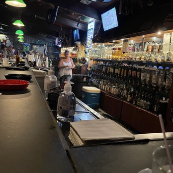 Boozgeois Saloon - a bartender at the bar - Dive Bars Near Me - Fort Pierce, Florida