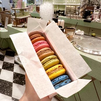 Ladurée - Beverly Hills - macaron flavors (from top to bottom) coffee, rose, salted caramel, pistachio, marie antoinette tea, black currant violet - Macarons Near Me - Beverly Hills, California Ladurée - Beverly Hills - macaron flavors (from top to bottom) coffee, rose, salted caramel, pistachio, marie antoinette tea, black currant violet - Macarons Near Me - Beverly Hills, California