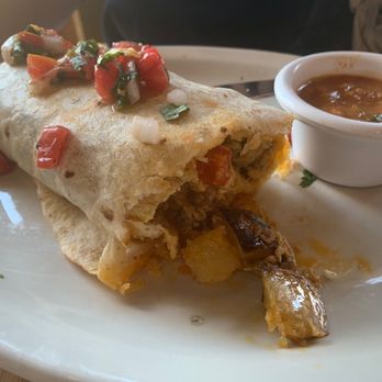 The Wild Plum Cafe - Breakfast Burrito - Choice of Meat (Bacon) and Scrambled Eggs with Onions, Peppers, Potatoes, Cilantro, Spices, Cheese, and Housemade Salsa - Bakeries Near Me - Monterey, California The Wild Plum Cafe - Breakfast Burrito - Choice of Meat (Bacon) and Scrambled Eggs with Onions, Peppers, Potatoes, Cilantro, Spices, Cheese, and Housemade Salsa - Bakeries Near Me - Monterey, California